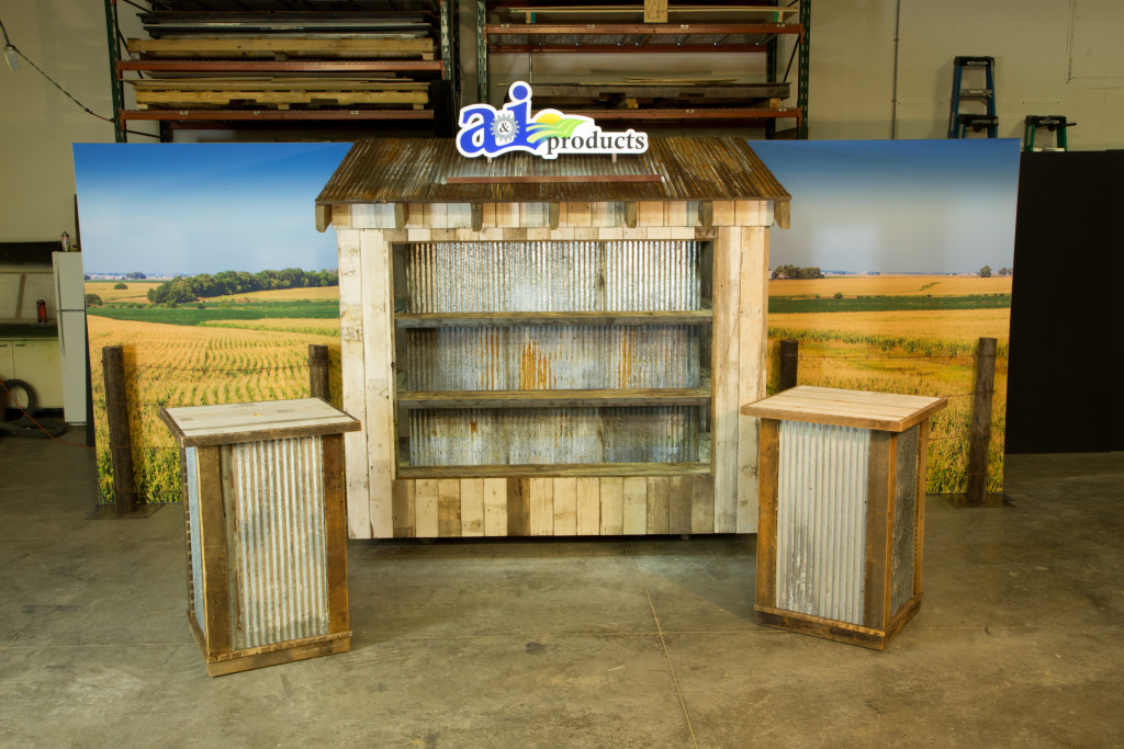 In addition to customized travel crates, the full display includes a backdrop and discussion tables.